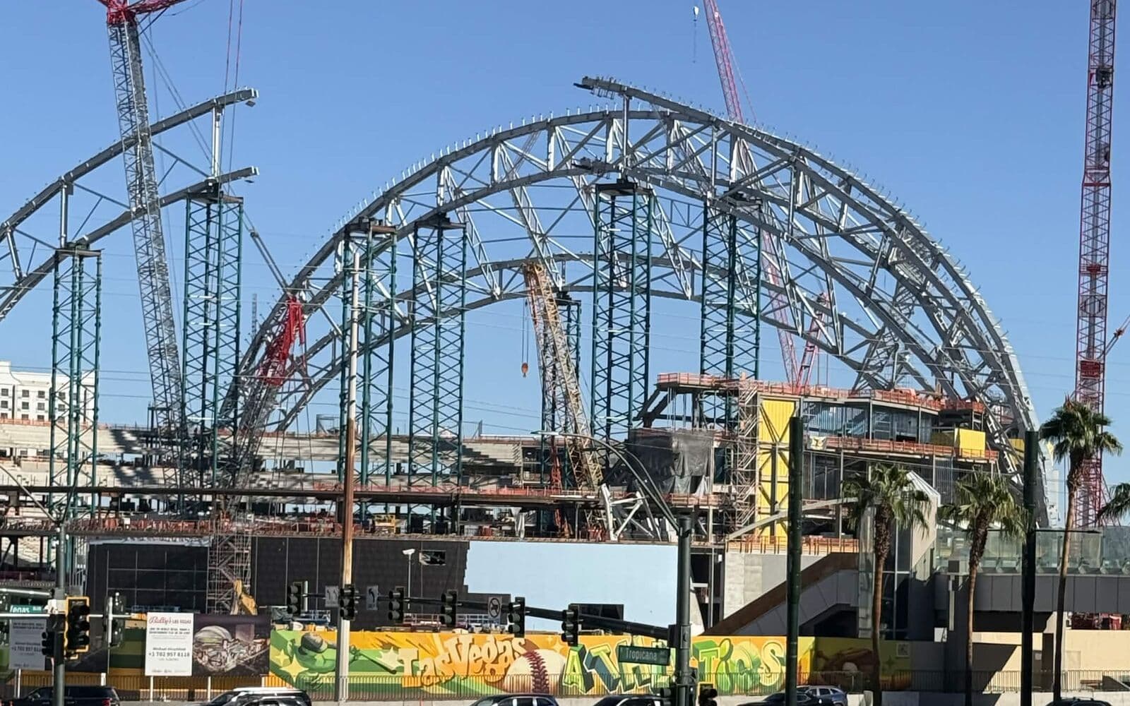 The Las Vegas Athletics ballpark roof arch rising over the Las Vegas Strip