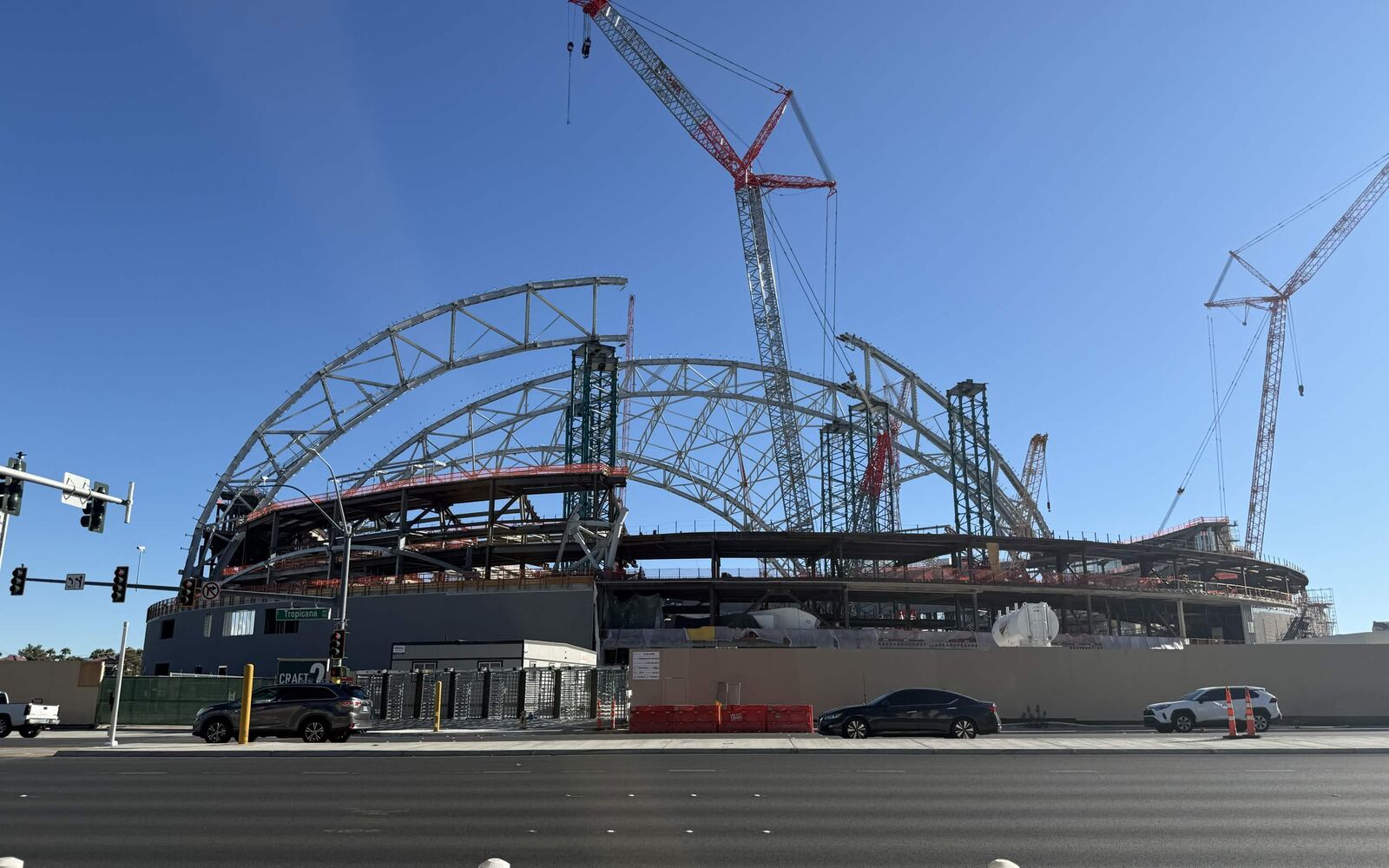 Las Vegas Athletics ballpark under construction on the Las Vegas Strip, with steel roof arches and tower cranes